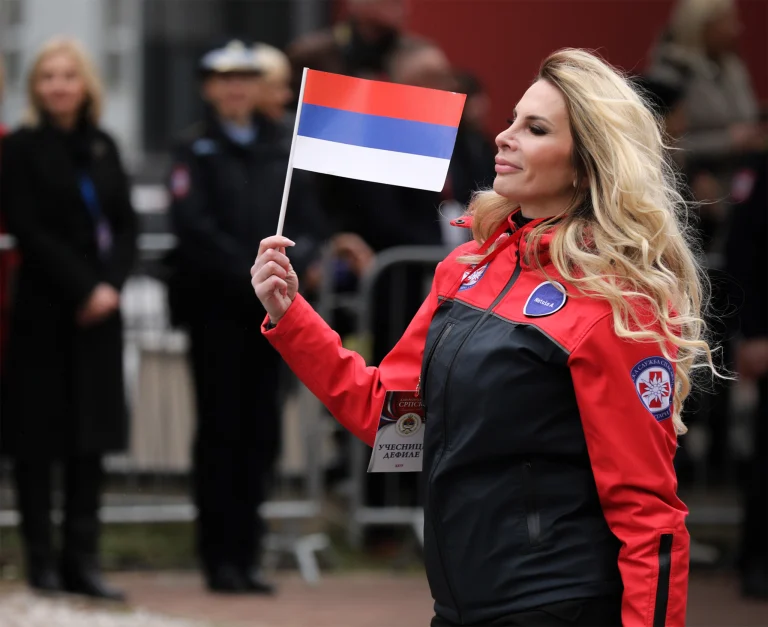 A participant carries the flag of Republika Srpska in Sarajevo.