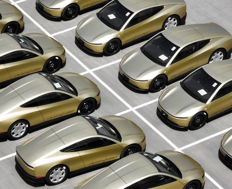 Tesla\'s driverless Cybercabs, built without steering wheels or pedals, line up before entering service in Austin. Photo: Jay Janner/The Austin American-Statesman via Getty Images